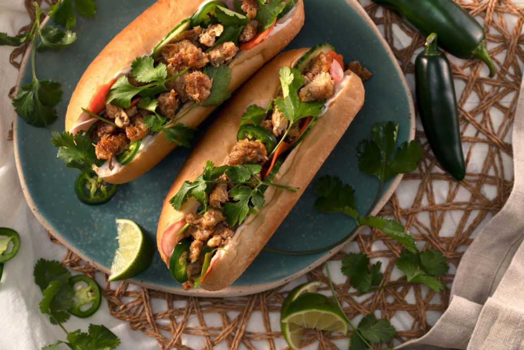 Hungry Planet pork banh mi sandwich on a hoagie bun topped with cilantro and lime